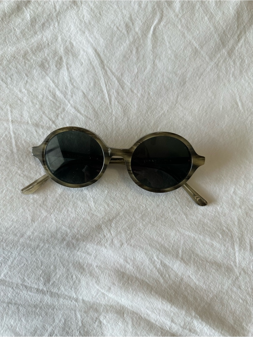 Han Kjobenhavn gray ish tortoise style round sunglasses with black lenses